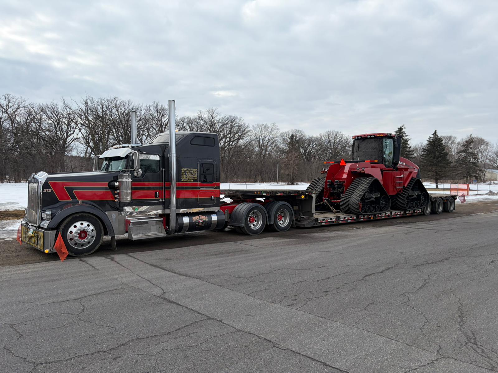 Case Quadtrac four-track tractor loaded on a River Trails Transport RGN double drop trailer