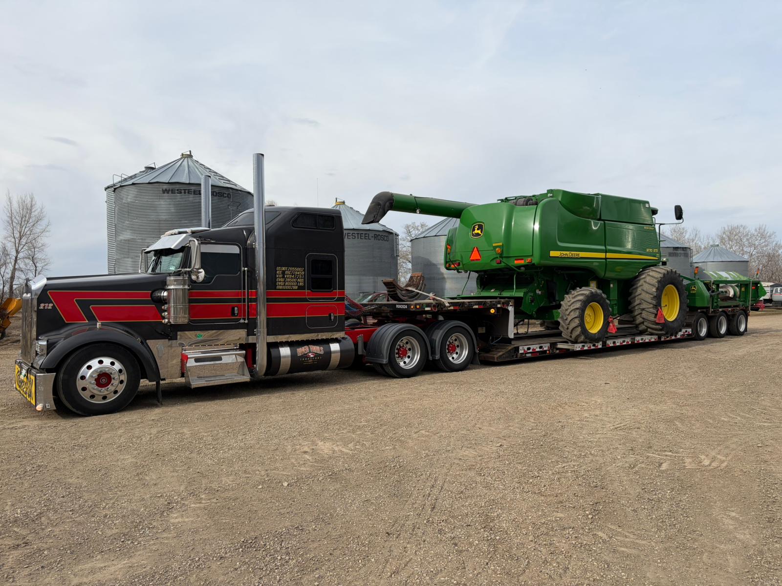 Combine being moved between fields on a Manitoba farm